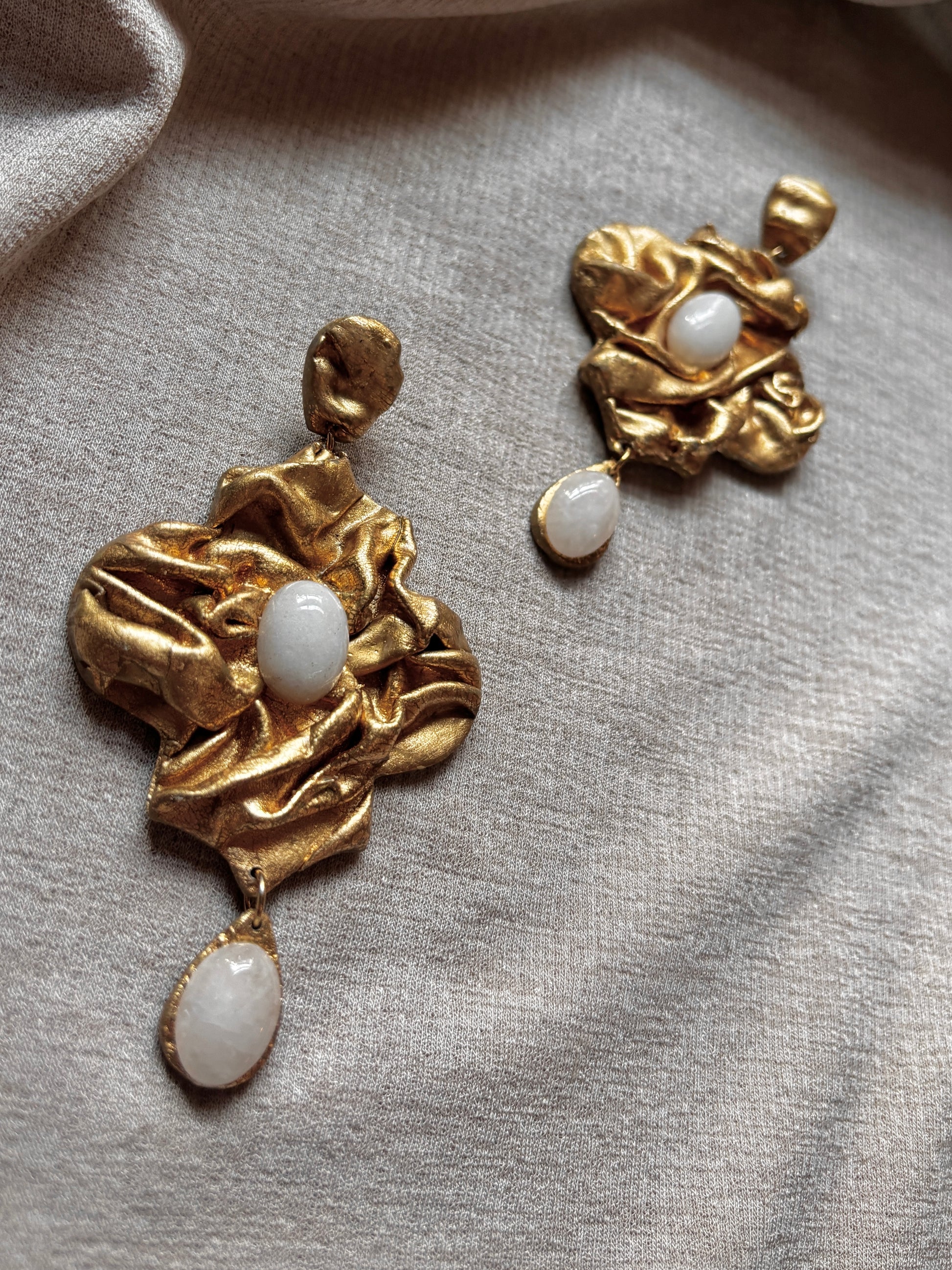 Detail of white quartz on Nidara chandelier earrings