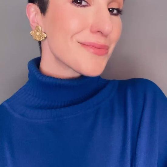 Model wearing Tahmina Ava & Azar handcrafted fan stud gold earrings clip ons non pierced