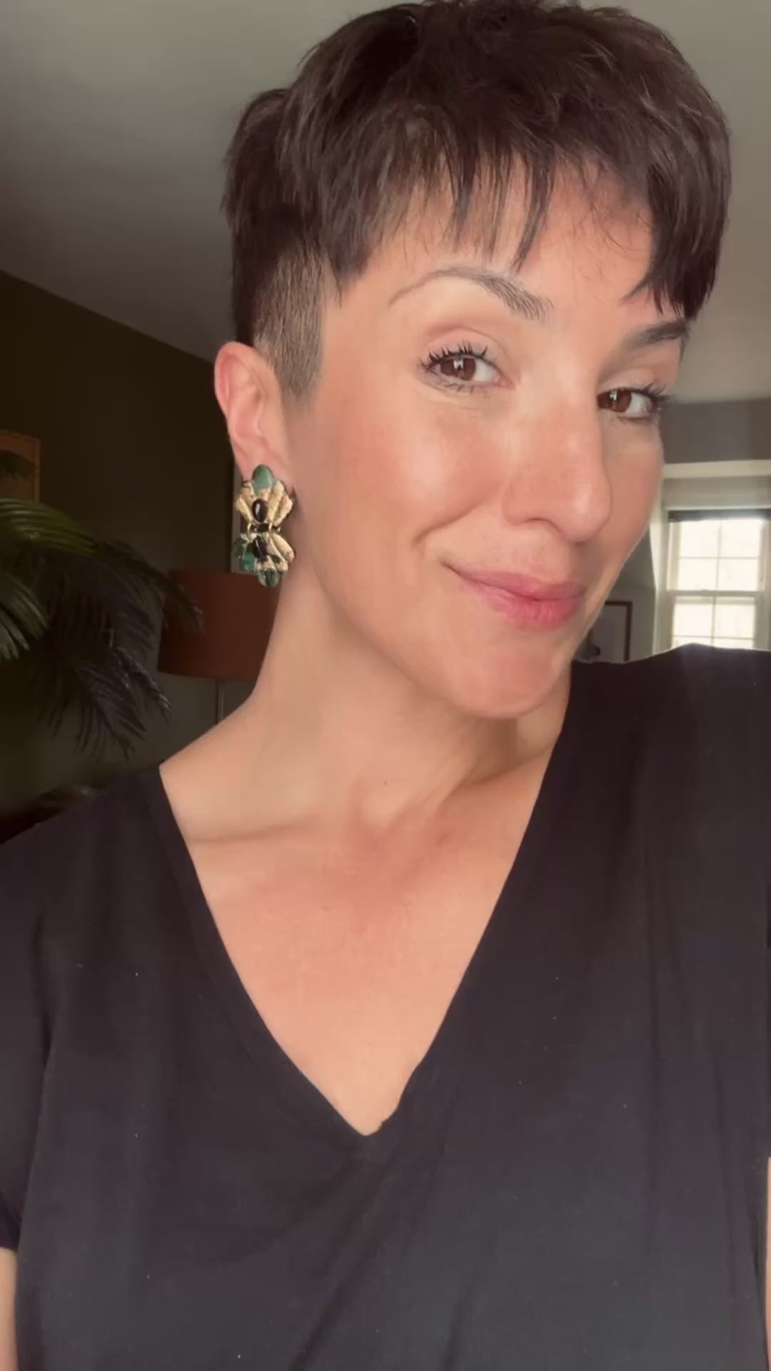 Model wearing the Ava & Azar small Caspian earrings 