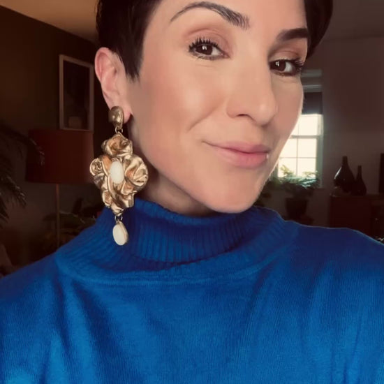 Model wearing Nidara antique gold chandelier earrings